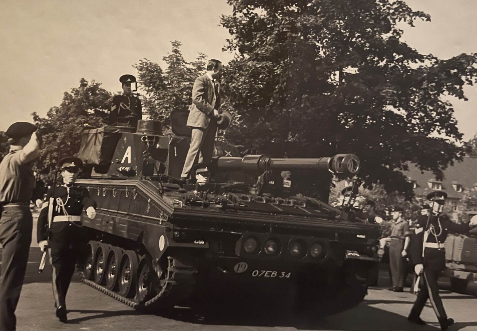 A group of men on a tank
Description automatically generated with low confidence